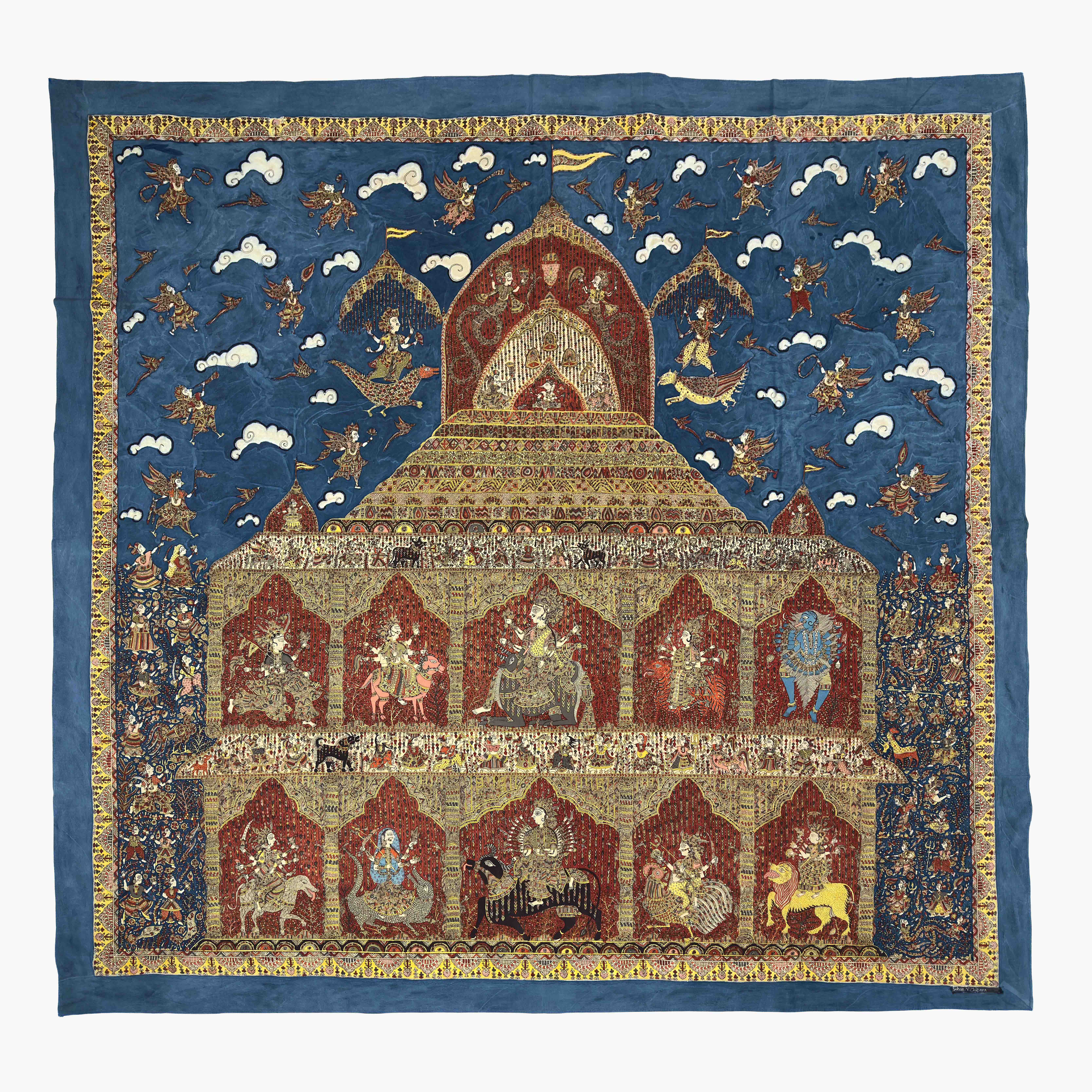 A textile titled Ten Mother Goddesses which displays several goddesses on mounts in a temple on a blue background with lots of details.